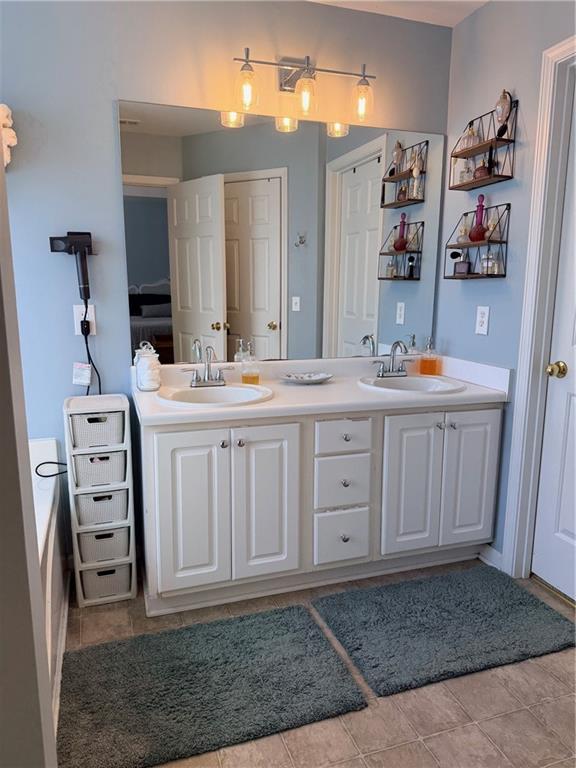 59 Indian Hills Drive Rydal, GA 30171 - Photo 14 of 35 a bathroom with a sink a vanity and a mirror