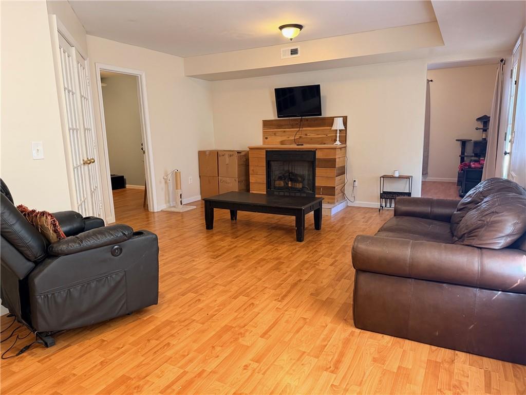 59 Indian Hills Drive Rydal, GA 30171 - Photo 20 of 35 a living room with furniture and a flat screen tv