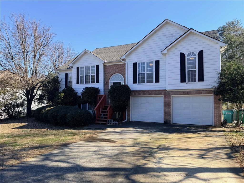 59 Indian Hills Drive Rydal, GA 30171 - Photo 2 of 35 a front view of a house with a yard