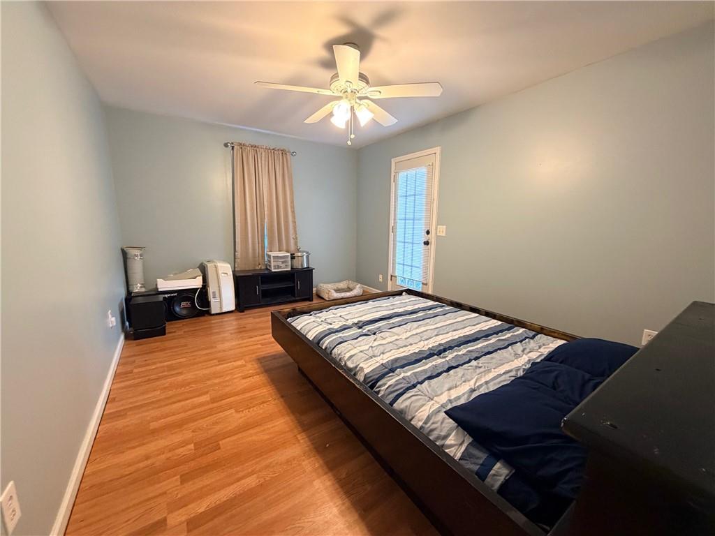 59 Indian Hills Drive Rydal, GA 30171 - Photo 23 of 35 a bedroom with a bed and a chandelier