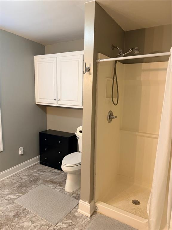 59 Indian Hills Drive Rydal, GA 30171 - Photo 26 of 35 a bathroom with a granite countertop sink toilet and shower