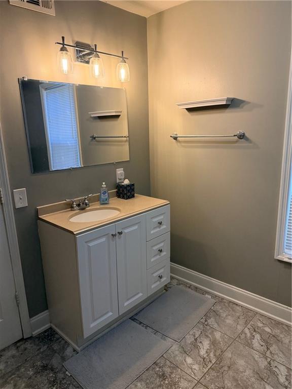 59 Indian Hills Drive Rydal, GA 30171 - Photo 27 of 35 a bathroom with a sink and a mirror