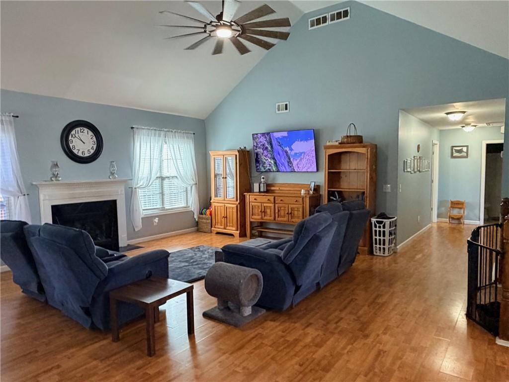 59 Indian Hills Drive Rydal, GA 30171 - Photo 3 of 35 a living room with furniture a clock and a fireplace