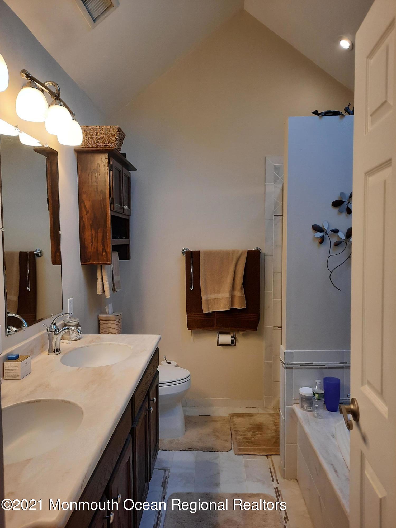 5 Dunhill Road Jackson, NJ 08527 - Photo 6 of 11 a bathroom with a sink a toilet and mirror