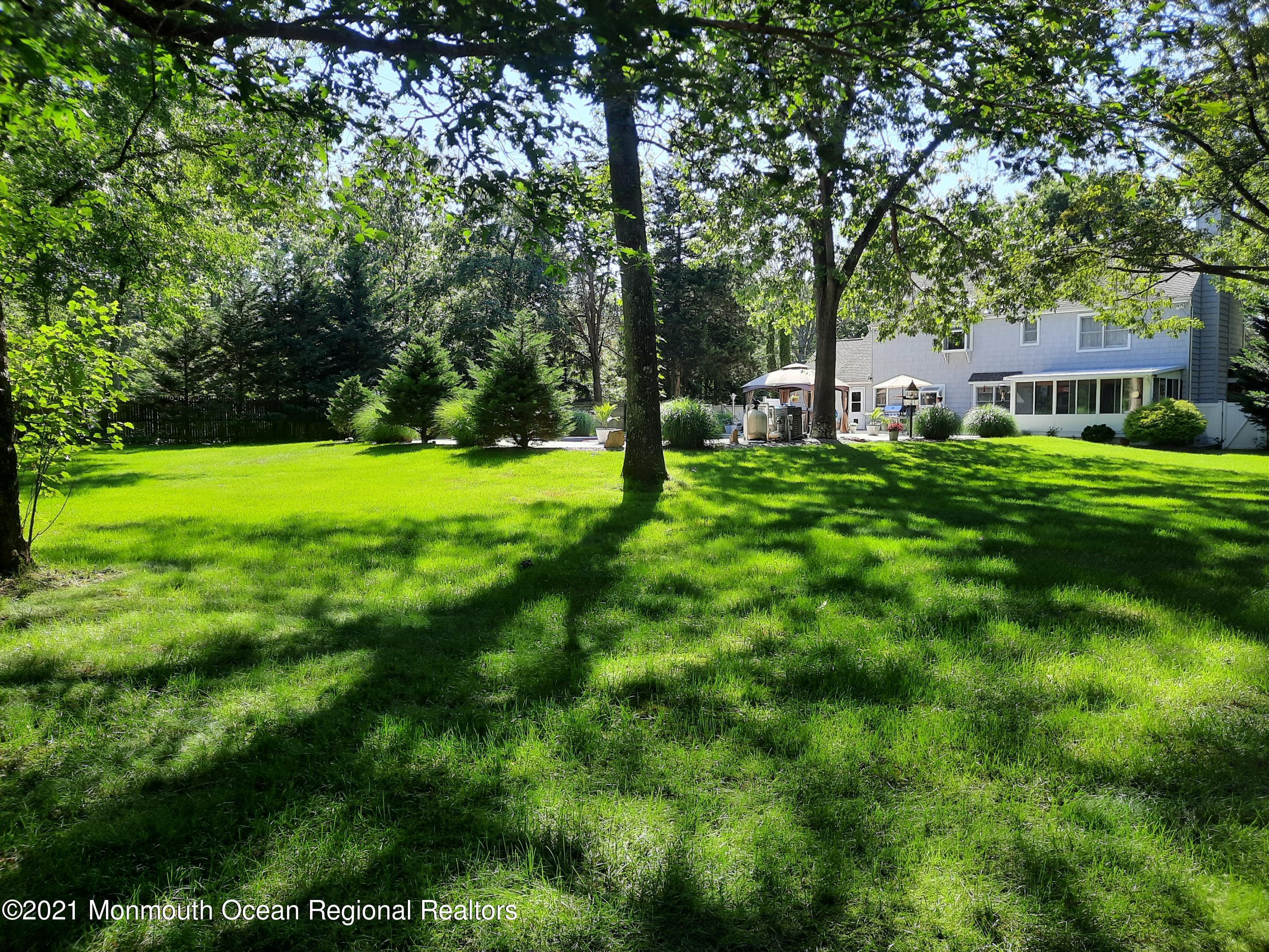5 Dunhill Road Jackson, NJ 08527 - Photo 10 of 11 a view of a big yard with plants and large trees