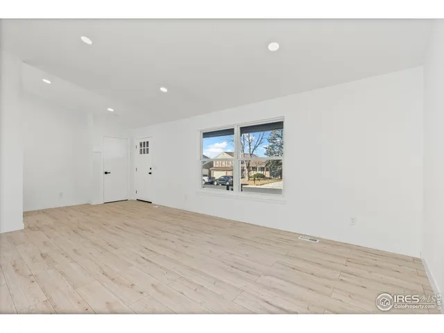a bathroom with a sink mirror vanity and toilet