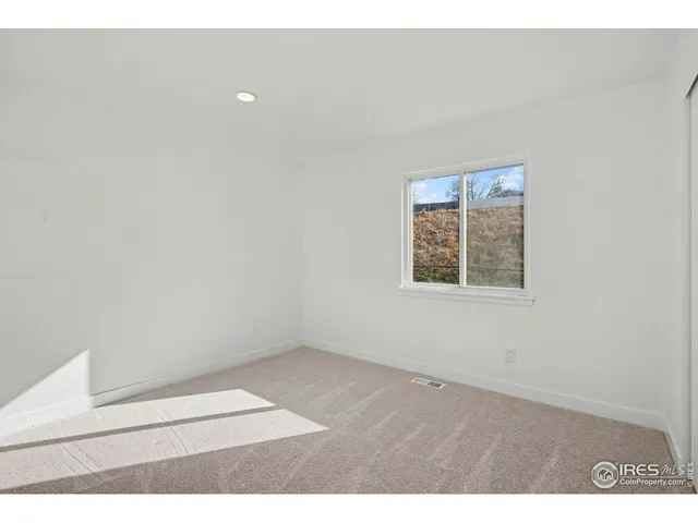 an empty room with a bench