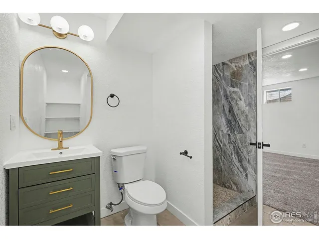 a living room with furniture and a glass door