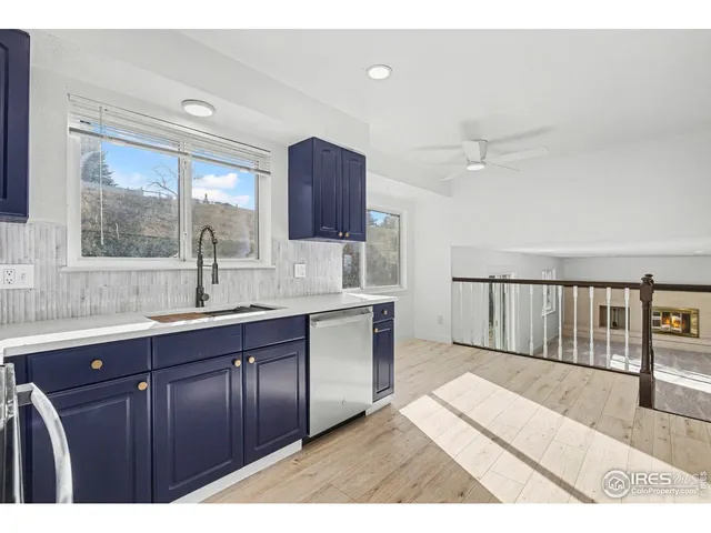 a kitchen with stainless steel appliances granite countertop a sink stove and microwave