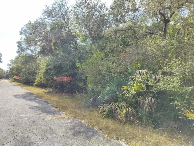 a view of swimming pool with a yard