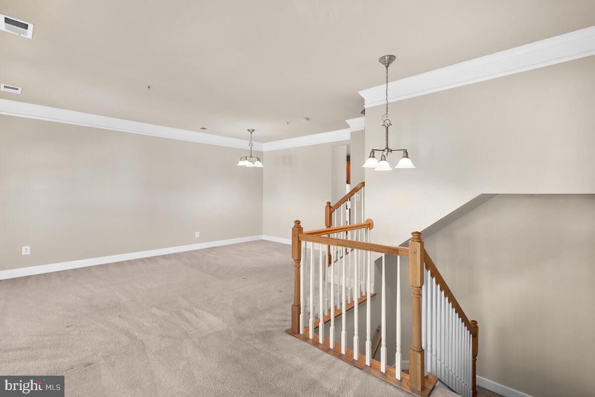 13626 Dover Cliffs Place Germantown, MD 20874 - Photo 13 of 32 a view of a hallway with stairs