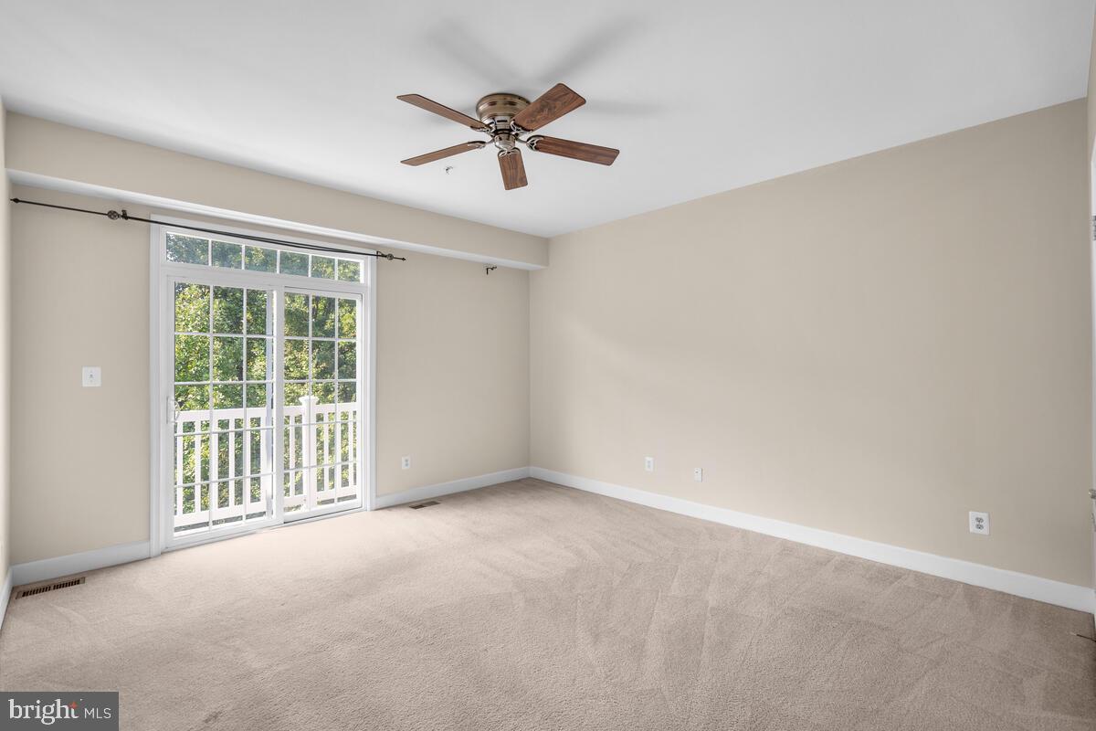 13626 Dover Cliffs Place Germantown, MD 20874 - Photo 18 of 32 a view of an empty room with a window