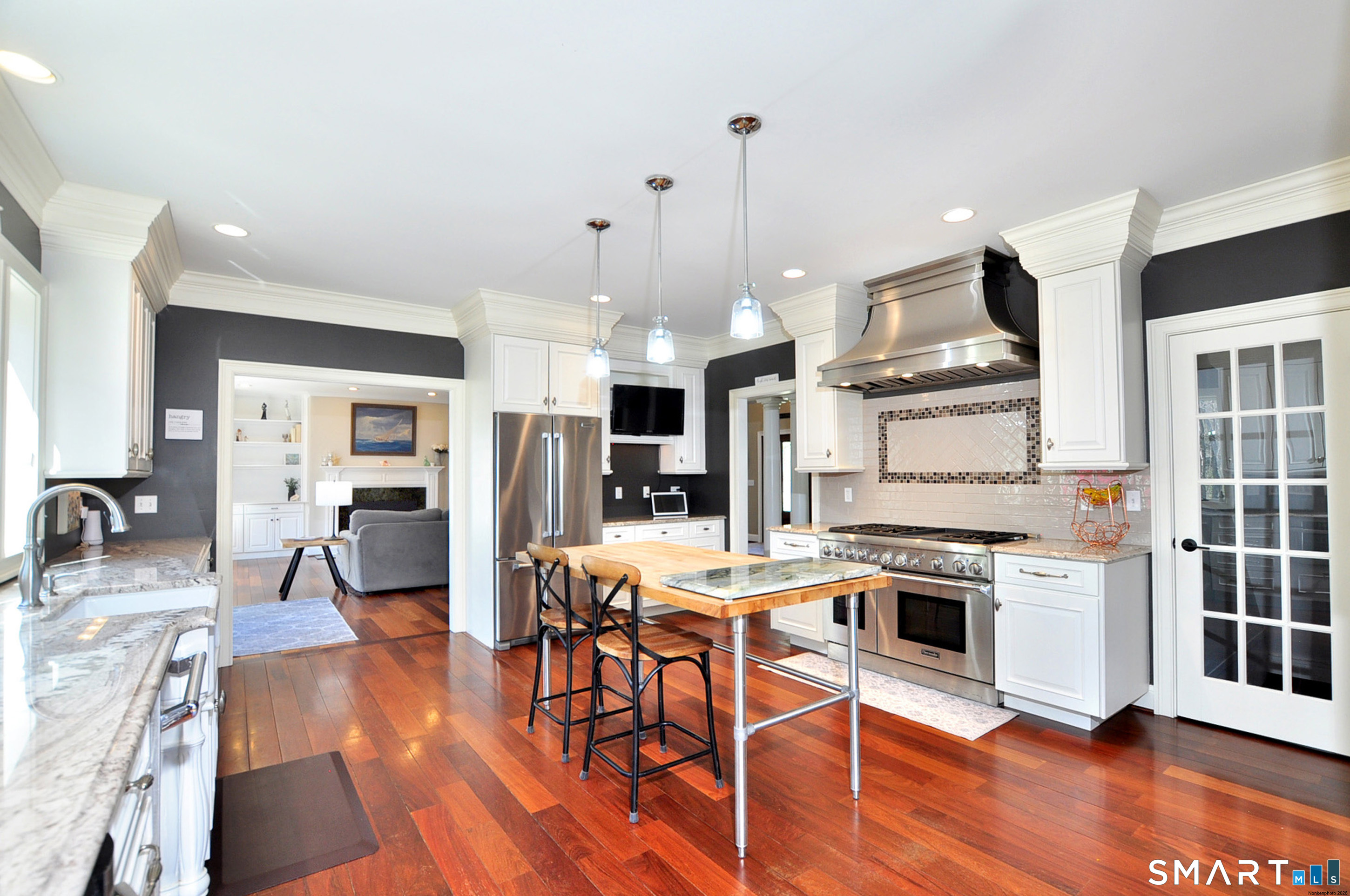 82 Indian Hill Road Canton, CT 06019 - Photo 11 of 41 stainless appliances with 6 gas cooktop and griddle. An induction hood that is also vented to the exterior