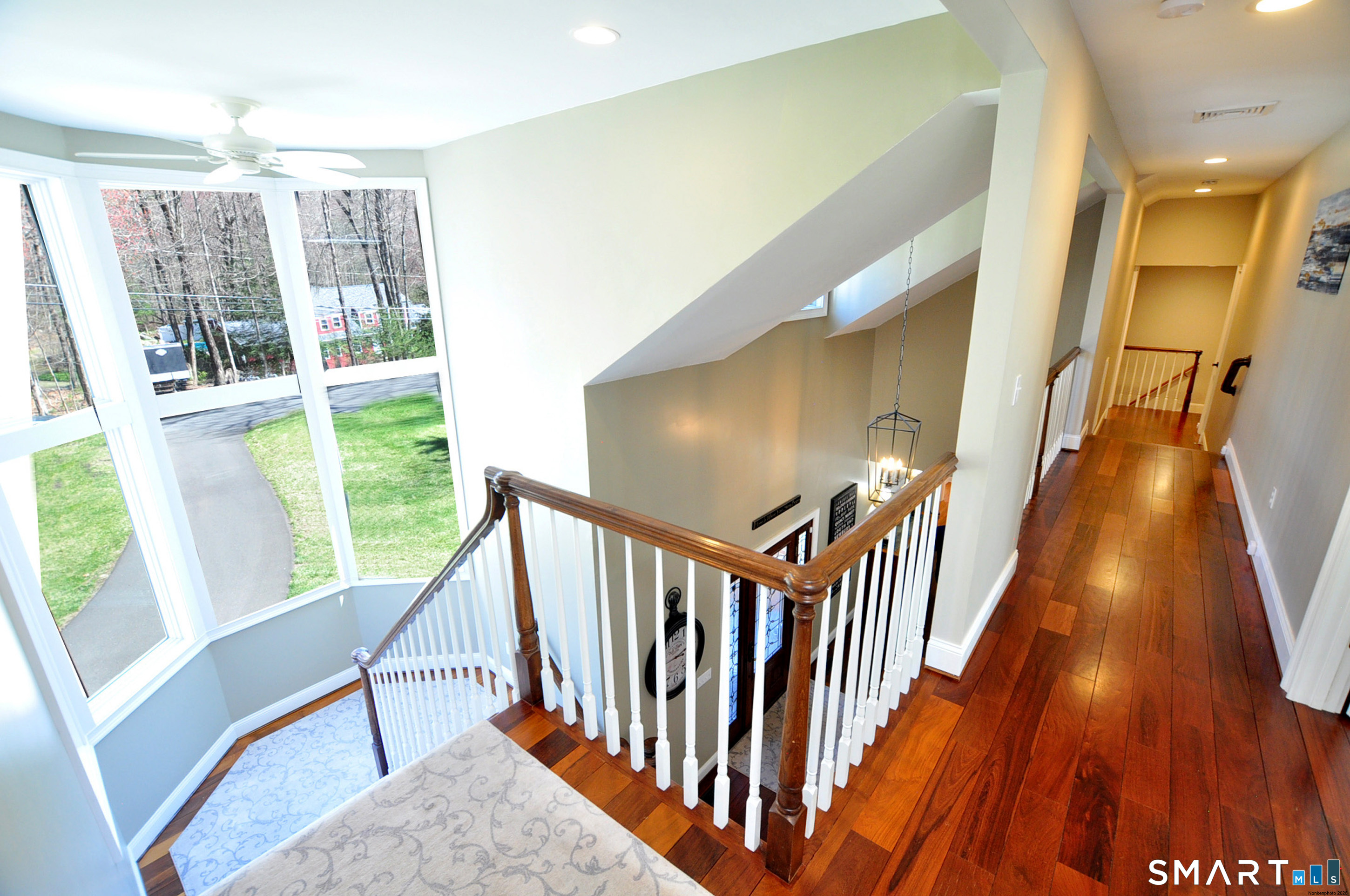 82 Indian Hill Road Canton, CT 06019 - Photo 18 of 41 Gorgeous staircase with large bright windows