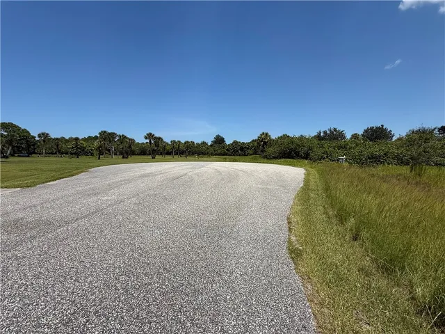 a view of a lake with houses in the back