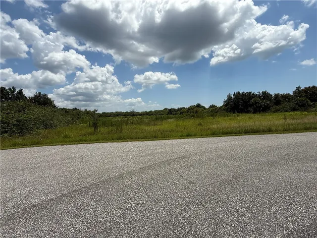 a view of an ocean and a yard
