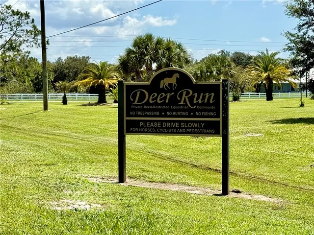 a view of a park with welcome board