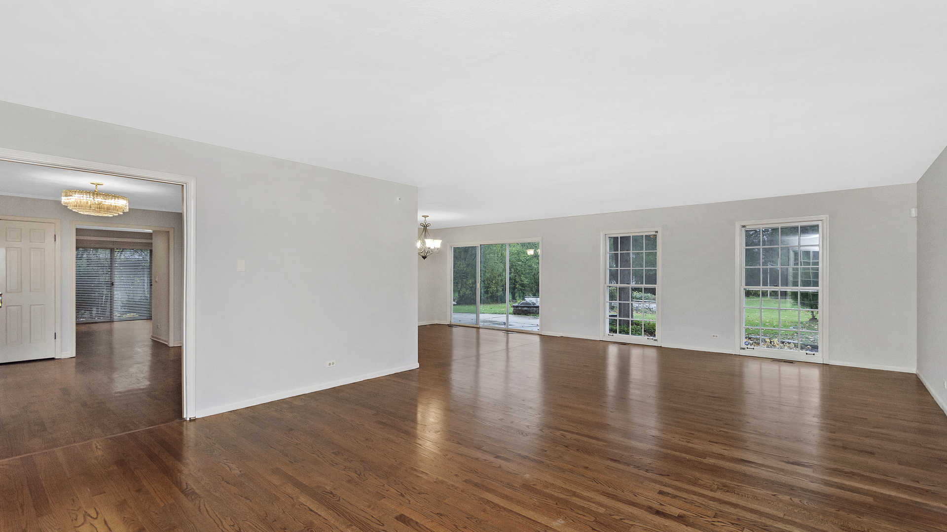 2091 Old Briar Road Highland Park, IL 60035 - Photo 3 of 19 an empty room with wooden floor and windows