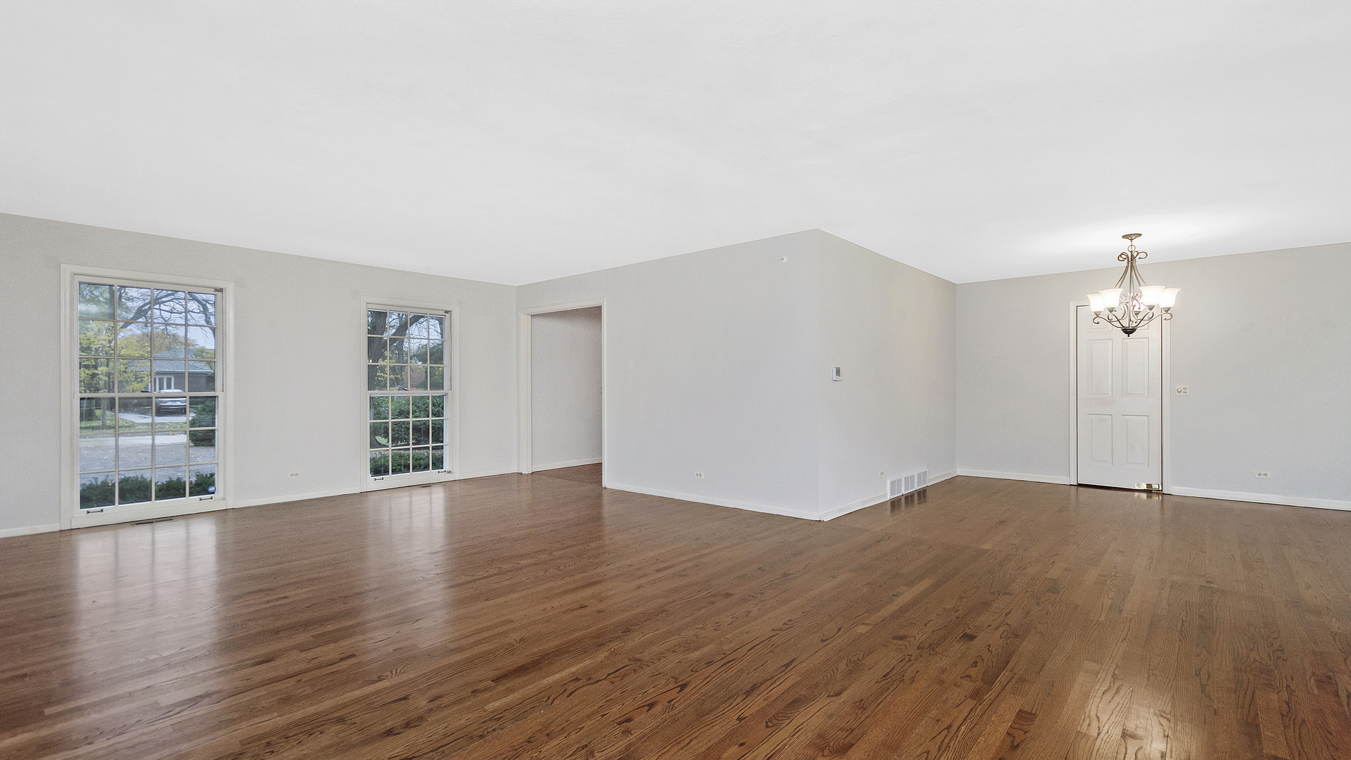2091 Old Briar Road Highland Park, IL 60035 - Photo 4 of 19 a view of an empty room with wooden floor and a window