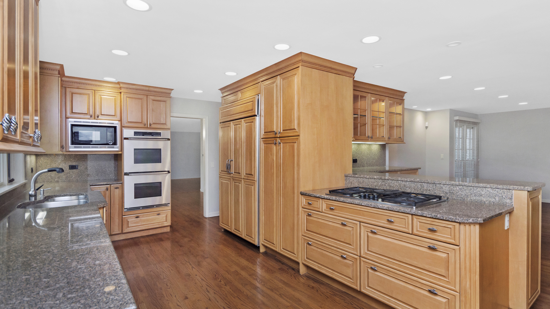 2091 Old Briar Road Highland Park, IL 60035 - Photo 6 of 19 a kitchen with stainless steel appliances granite countertop a stove and a refrigerator