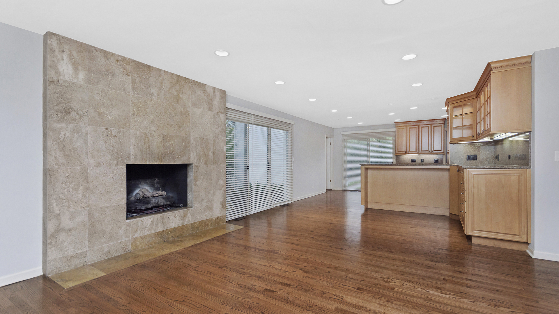 2091 Old Briar Road Highland Park, IL 60035 - Photo 7 of 19 a view of kitchen with kitchen island a sink wooden floor and a fireplace