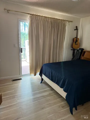 a bedroom with a bed and a table in it