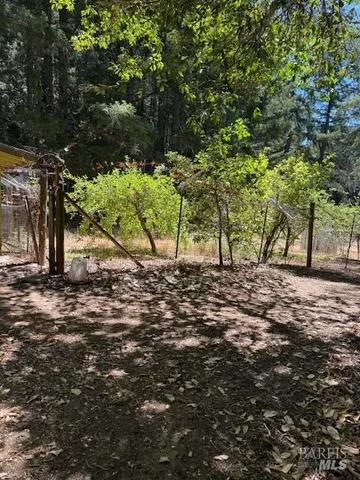 a view of a backyard of the house
