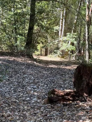 a sign board with a yard