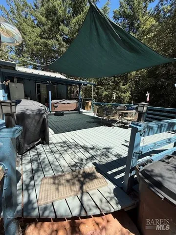 a kitchen with stainless steel appliances granite countertop a sink a stove and a cabinets