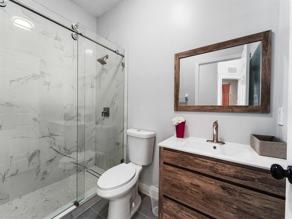 14815 Southwest 28 Lane Miami, FL 33185 - Photo 14 of 19 a bathroom with a toilet sink and shower