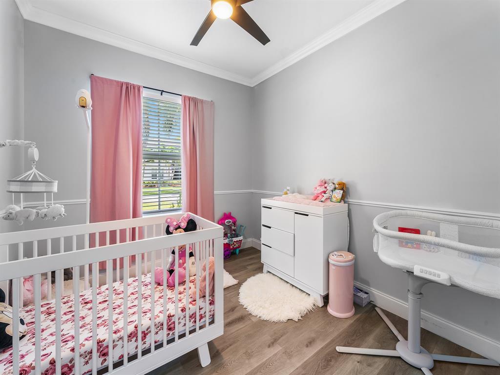 14815 Southwest 28 Lane Miami, FL 33185 - Photo 15 of 19 a bedroom with a bed and a window