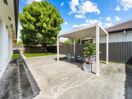 a view of a backyard with a patio