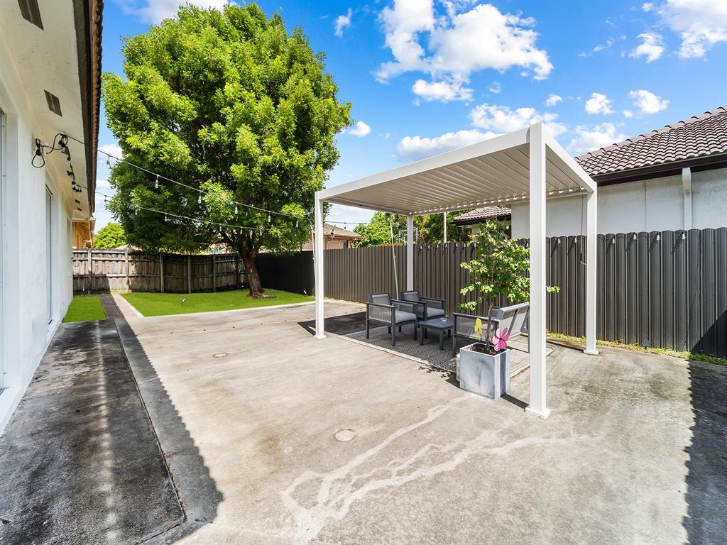14815 Southwest 28 Lane Miami, FL 33185 - Photo 16 of 19 a view of a backyard with a patio