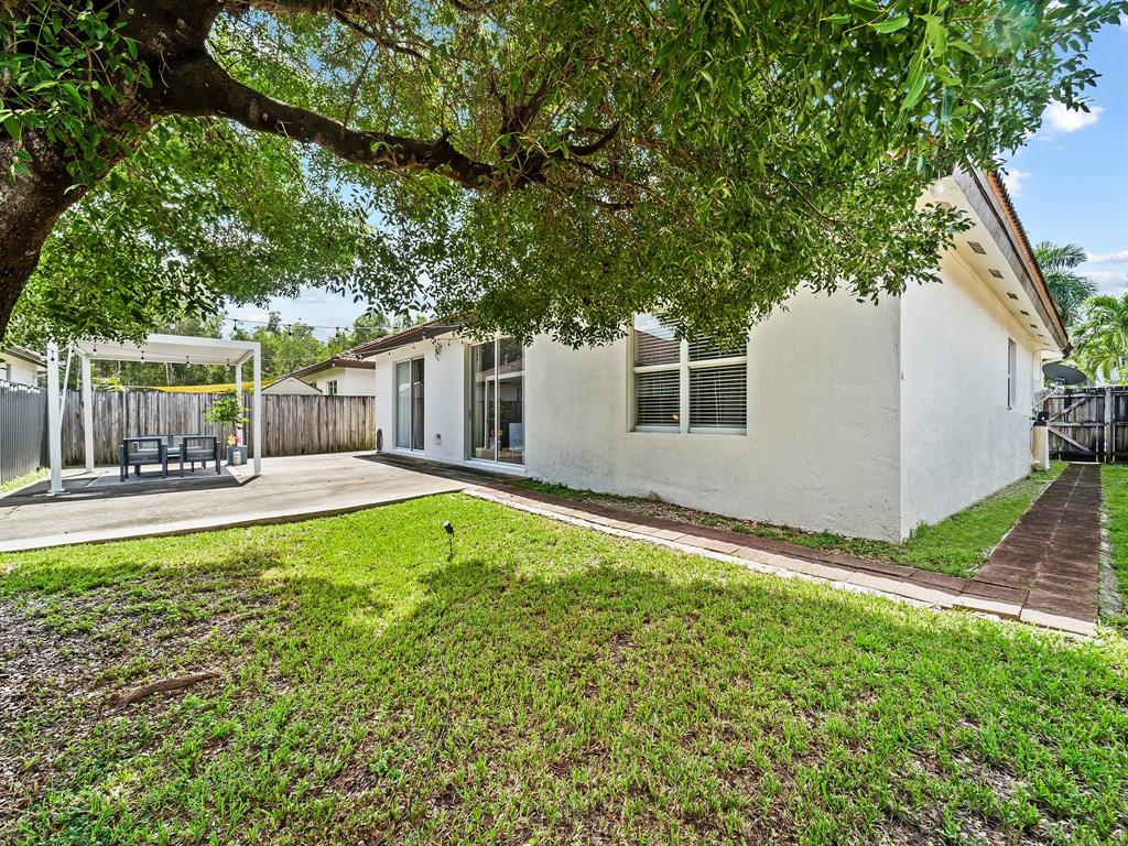 14815 Southwest 28 Lane Miami, FL 33185 - Photo 17 of 19 a front view of a house with garden