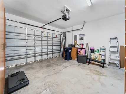 a bedroom with furniture and a flat screen tv
