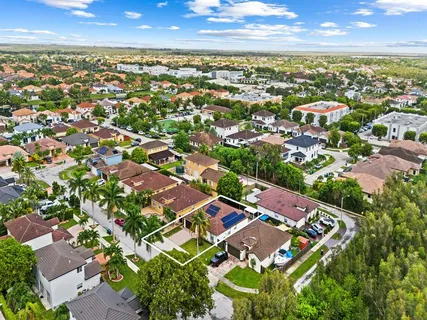 an aerial view of residential houses with outdoor space