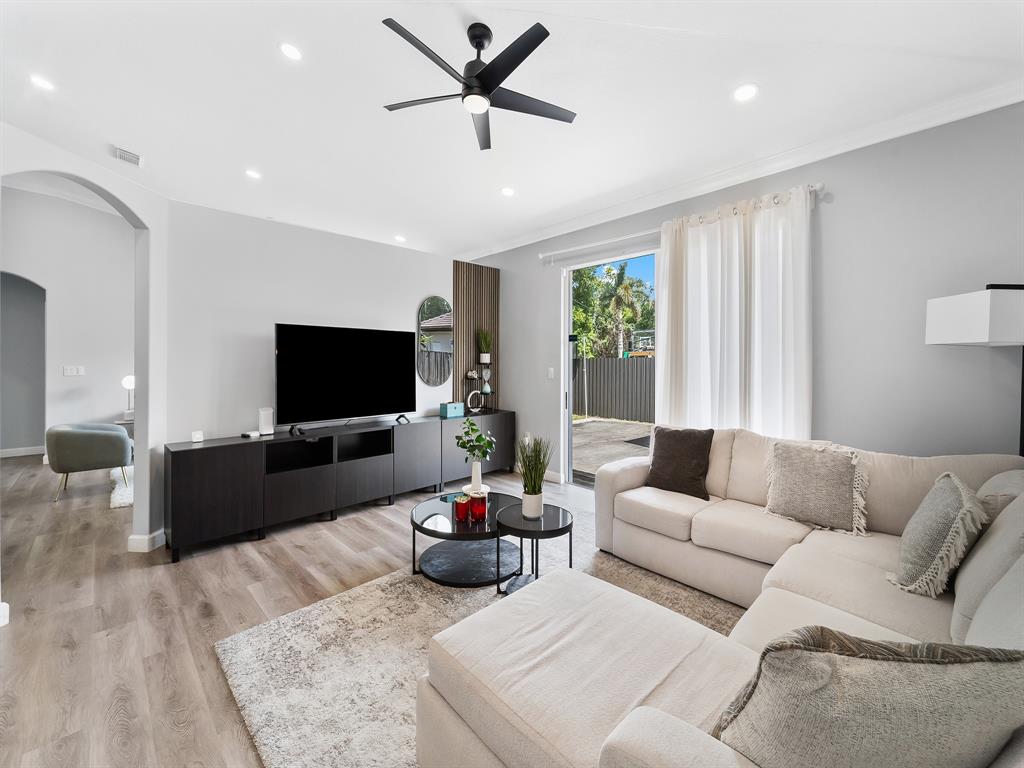 14815 Southwest 28 Lane Miami, FL 33185 - Photo 5 of 19 a living room with furniture and a flat screen tv