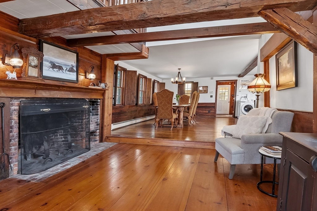 291 Still River Road Harvard, MA 01451 - Photo 13 of 42 a living room with furniture a fireplace and a table
