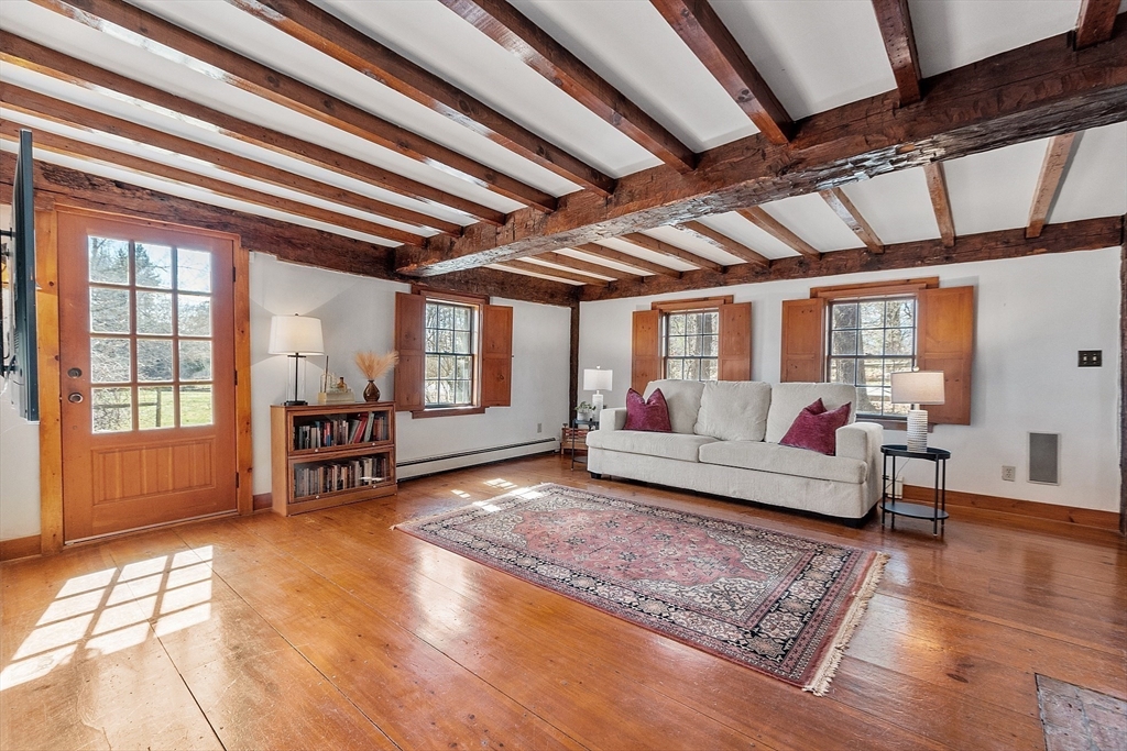 291 Still River Road Harvard, MA 01451 - Photo 14 of 42 a living room with furniture and a wooden floor