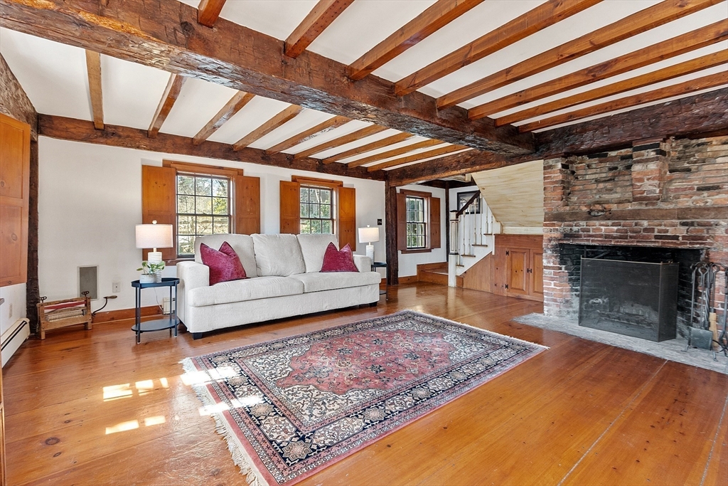 291 Still River Road Harvard, MA 01451 - Photo 15 of 42 a living room with furniture and a fireplace