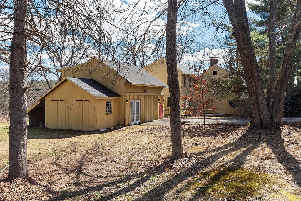 291 Still River Road Harvard, MA 01451 - Photo 2 of 42 a view of a house with a yard covered in snow