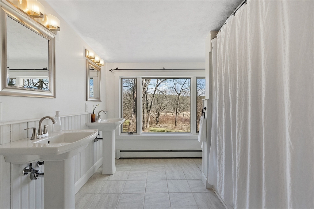 291 Still River Road Harvard, MA 01451 - Photo 26 of 42 a bathroom with a sink and a bathtub