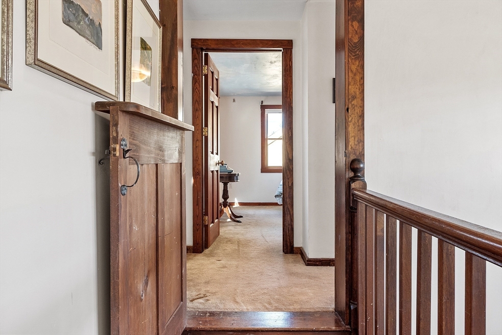 291 Still River Road Harvard, MA 01451 - Photo 27 of 42 a view of a hallway with wooden floor and staircase