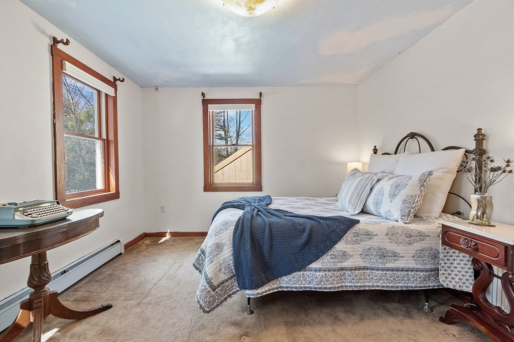 291 Still River Road Harvard, MA 01451 - Photo 29 of 42 a bedroom with a bed and window