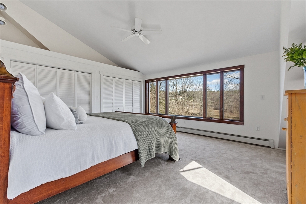 291 Still River Road Harvard, MA 01451 - Photo 31 of 42 a bed sitting in a spacious bedroom next to a window