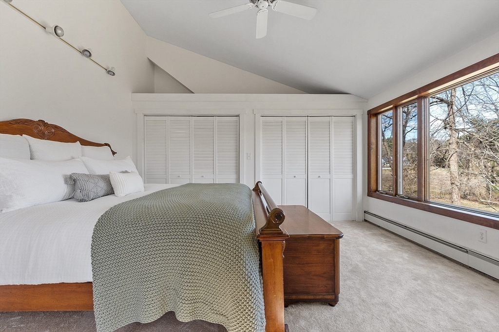 291 Still River Road Harvard, MA 01451 - Photo 32 of 42 a bedroom with a bed and a large window