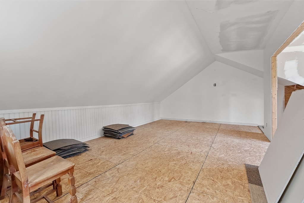 291 Still River Road Harvard, MA 01451 - Photo 35 of 42 a bedroom with a bed and a chair