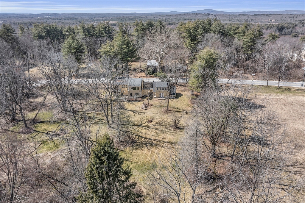 291 Still River Road Harvard, MA 01451 - Photo 42 of 42 a view of a field with trees in the background
