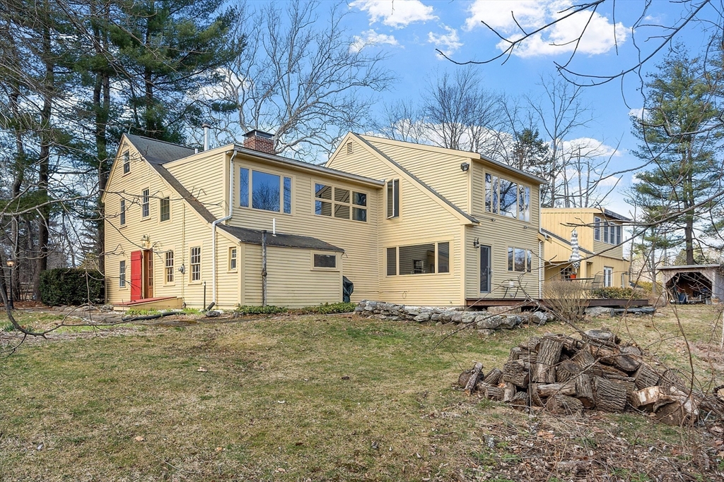 291 Still River Road Harvard, MA 01451 - Photo 5 of 42 a view of a white house with a yard
