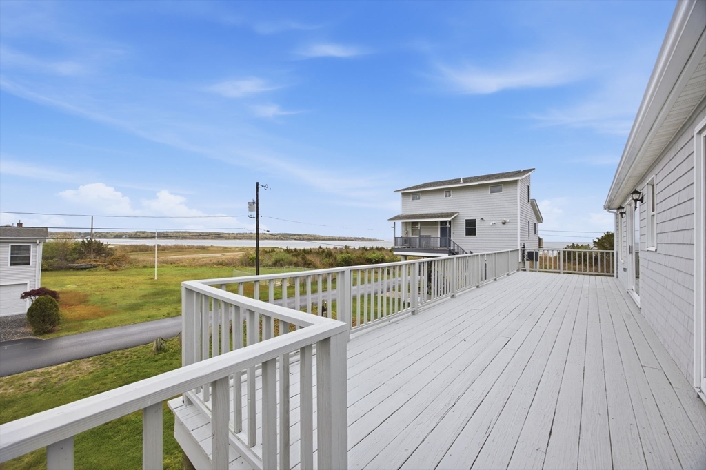 192 Swifts Beach Road Wareham, MA 02571 - Photo 3 of 38 a view of a balcony with dining space
